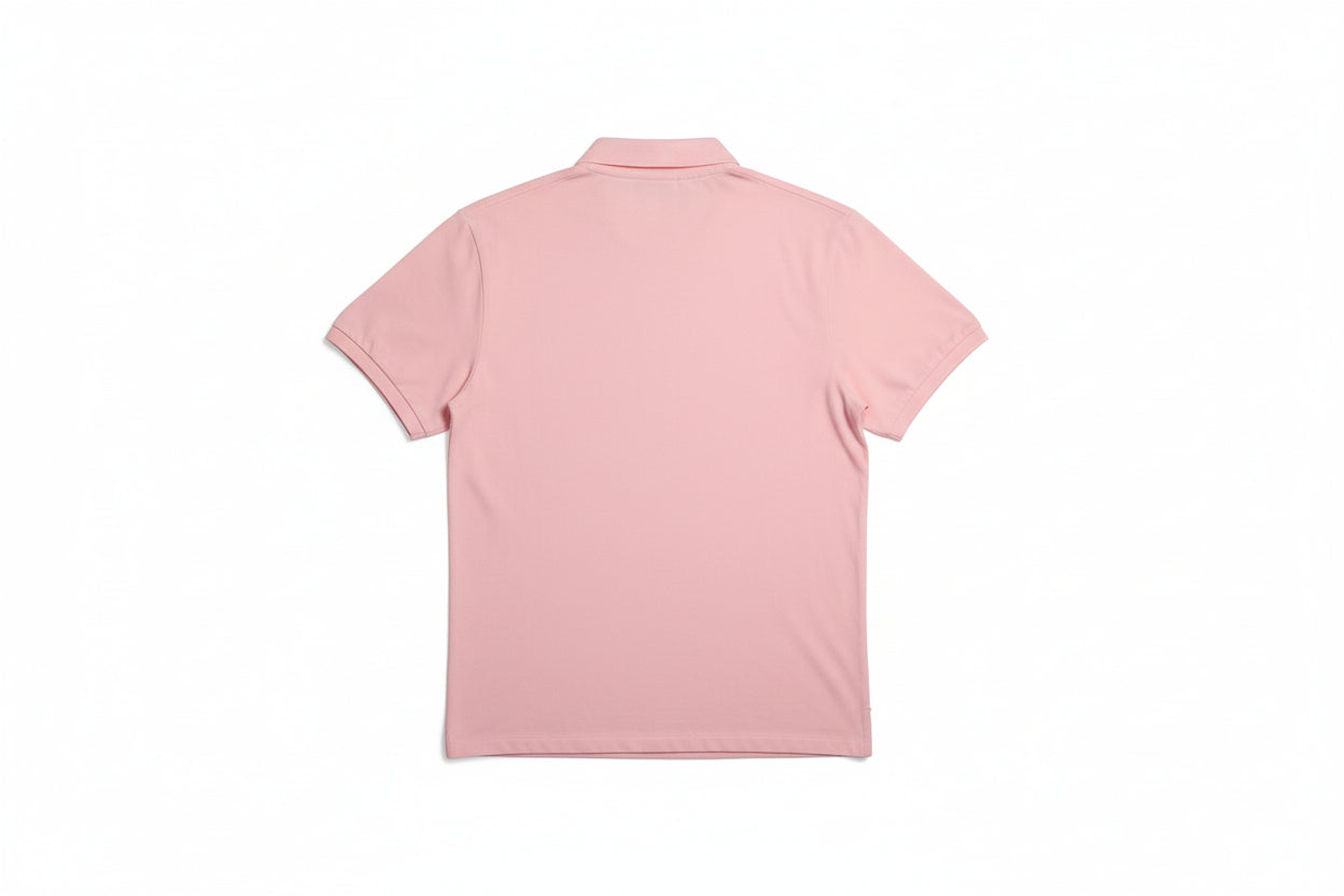 Pink shirt draped over a chair with a neutral background
