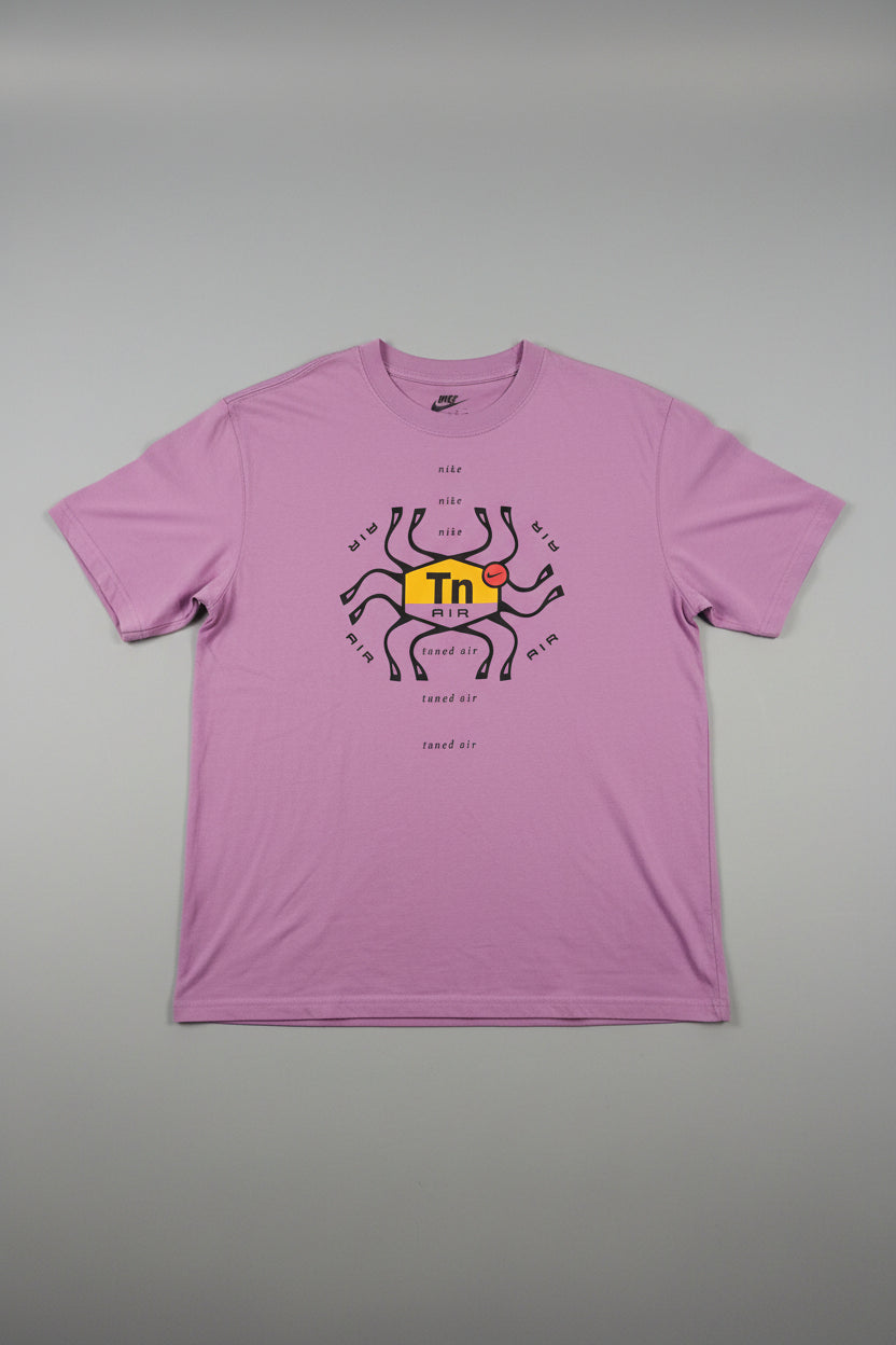 Pink hoodie with a graphic design on a hanger against a neutral background